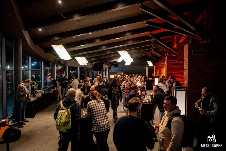 The foyer packed with people talking over food and drinks